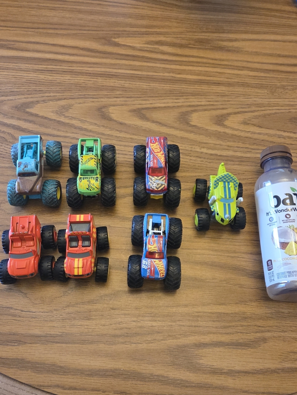 Lot of 7 small monster trucks, various brands